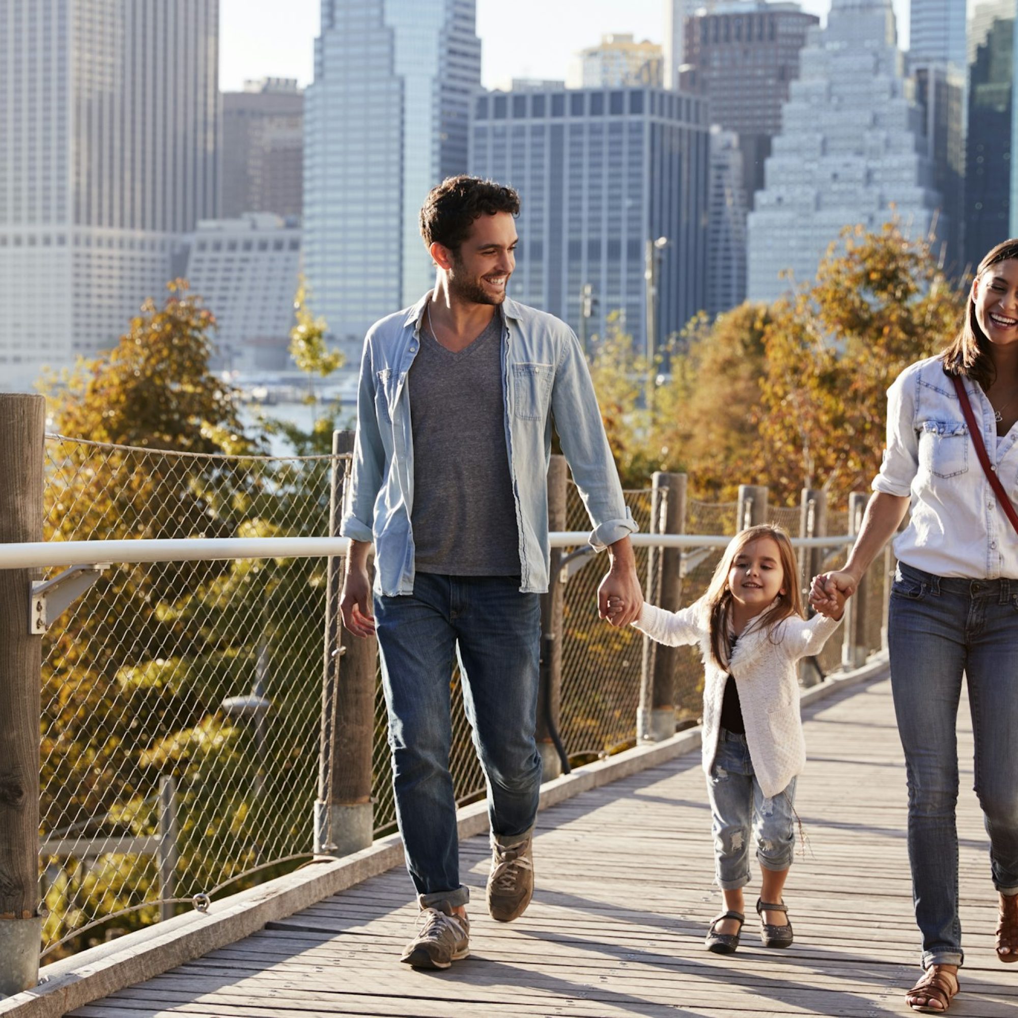 young-family-with-daughter-taking-a-walk-on-footbridge.jpg young-family-with-daughter-taking-a-walk-on-footbridge.jpg